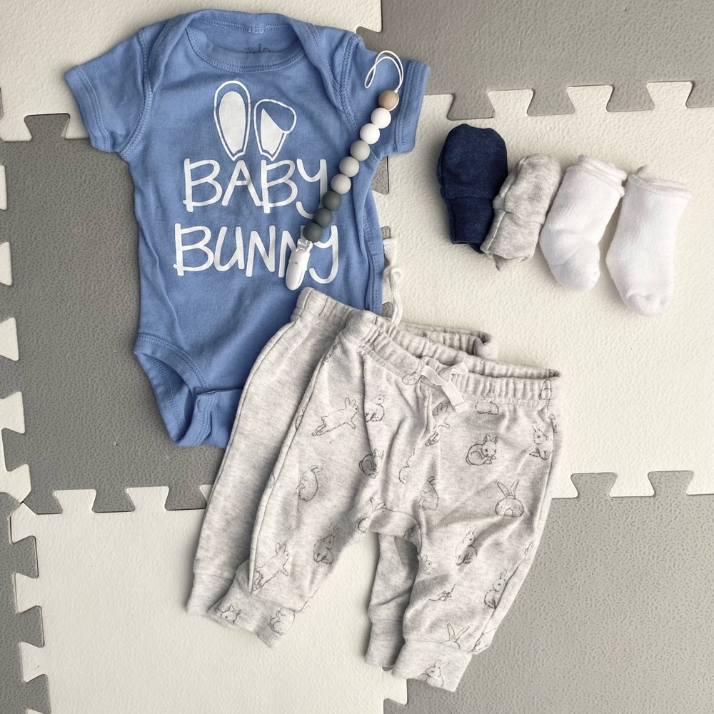 Baby bundle: onesie, sweat pants, & accessories.